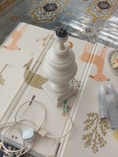 wood table lamp base with a tiered, traditional design.