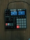 Maschine Plus with 19 expansion libraries and wooden stand.
