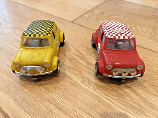 Two Scalextric Rally Mini Coopers C7 Yellow And Red with chequered roof