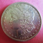 1904-O MORGAN SILVER DOLLAR. CIRCULATED. BETTER GRADE.