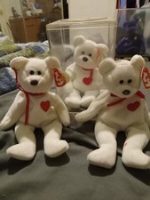 Defective Valentino bears, original princess Diana bear, and 2 peace bears.