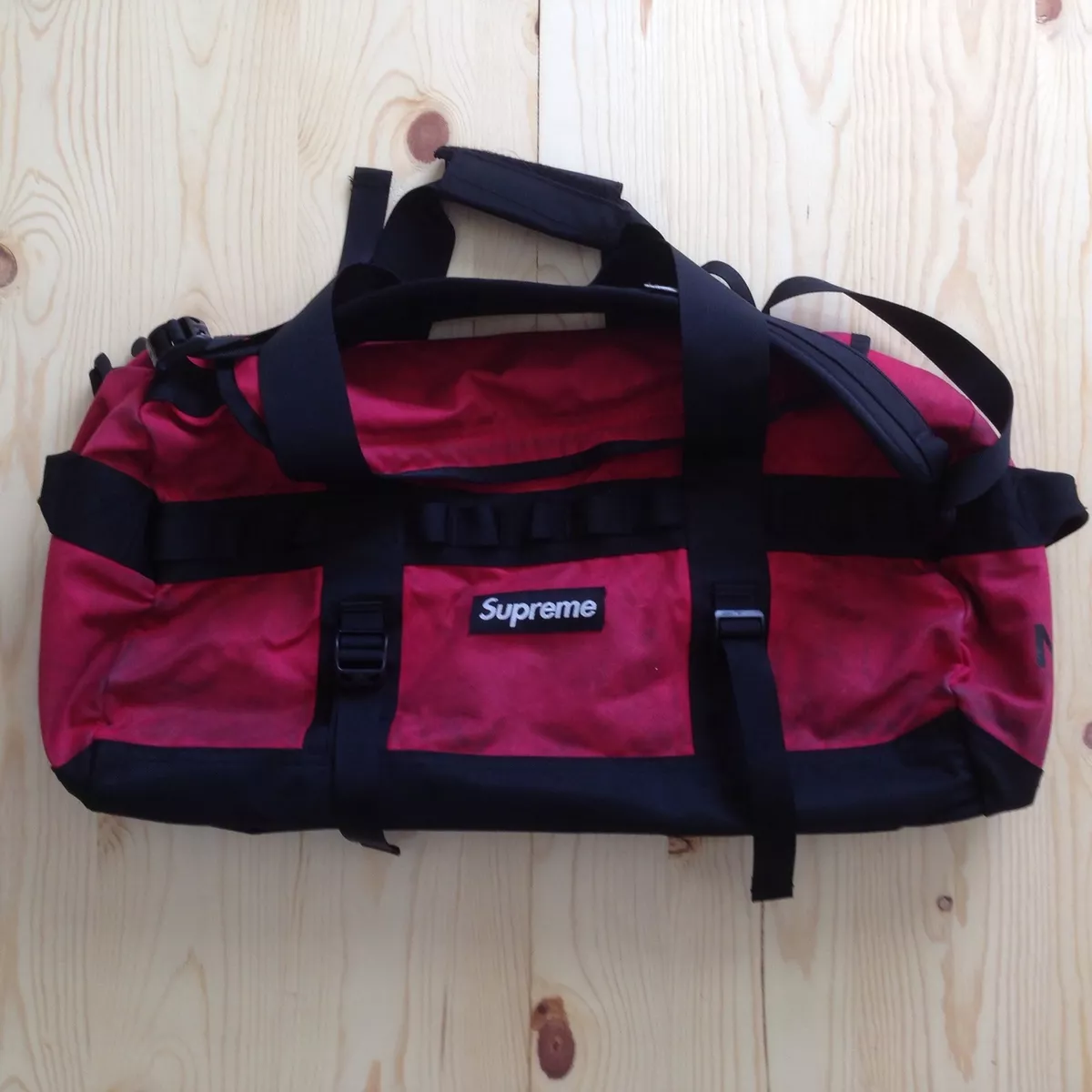 SUPREME x THE NORTH FACE WAXED BRITISH MILLERAIN BASECAMP DUFFLE BAG TNF RED