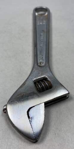 Silver 6-inch adjustable crescent wrench with worn handle, yellow “PROTO” logo, and metal jaw markings on a light background.