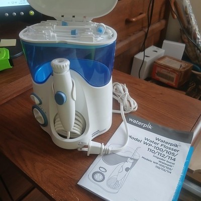 New Waterpik  Water Flosser WP-100W, Never Used, 4 Attachments