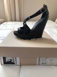 black patent leather wedges