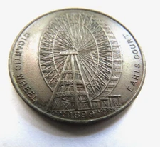 1899 THE GIGANTIC WHEEL AT EARLS COURT HARD TIMES TOKEN