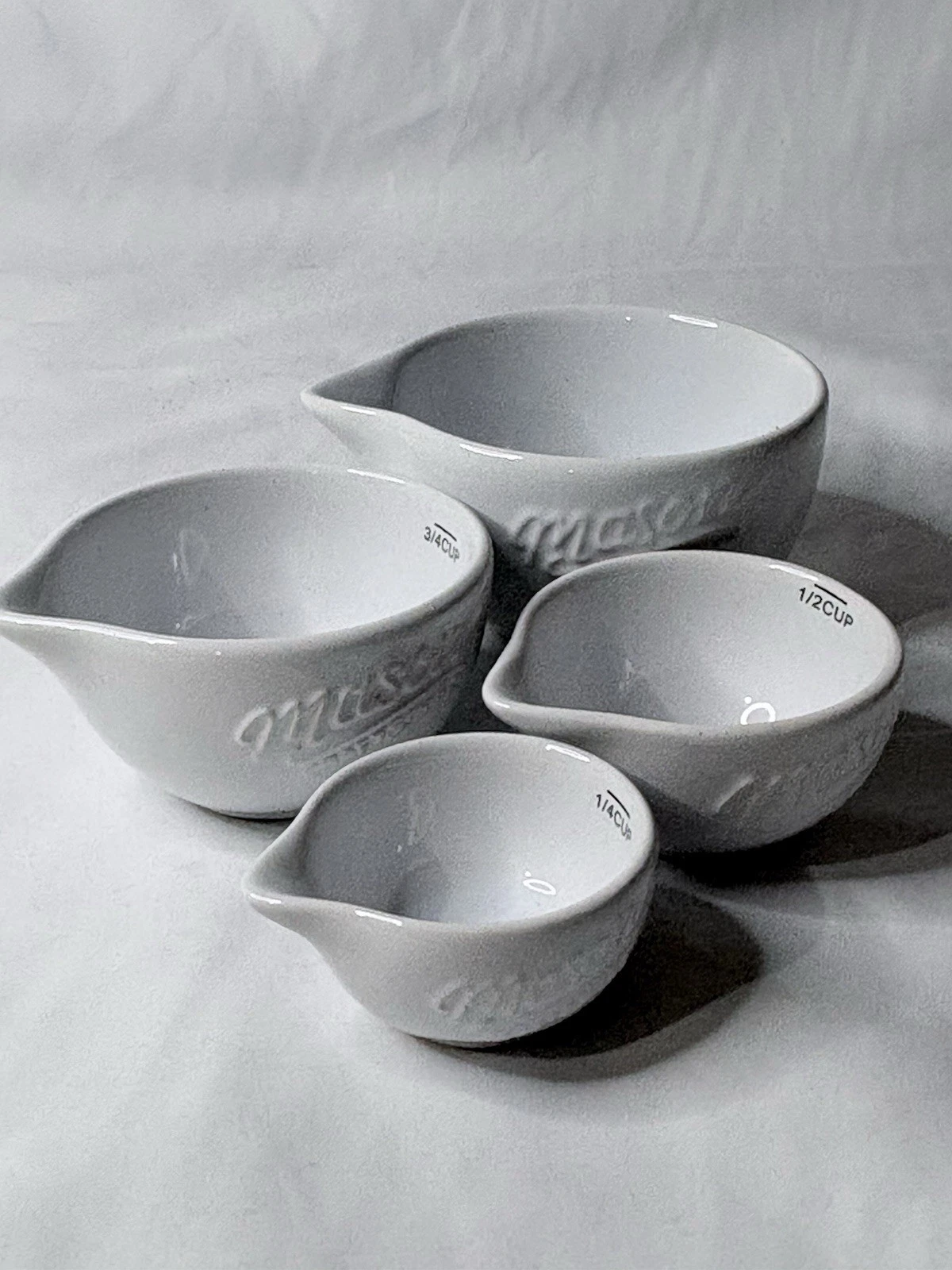 Mason Craft and More Stacking Ceramic Measuring Cups with Spouts Pouring Liquid