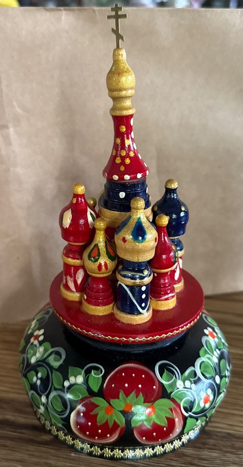 Wooden Russian music box shaped like St. Basil's Cathedral — a miniature of one of the world's most iconic buildings.