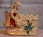 Vintage USA pottery Dutch girl watering flowers planter