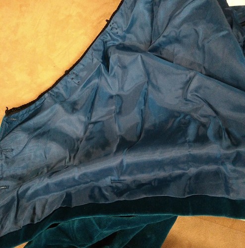 Blue velvet Doncaster blazer with satin-lined pockets and smooth fabric, showing inner dark blue cotton USA made tag.