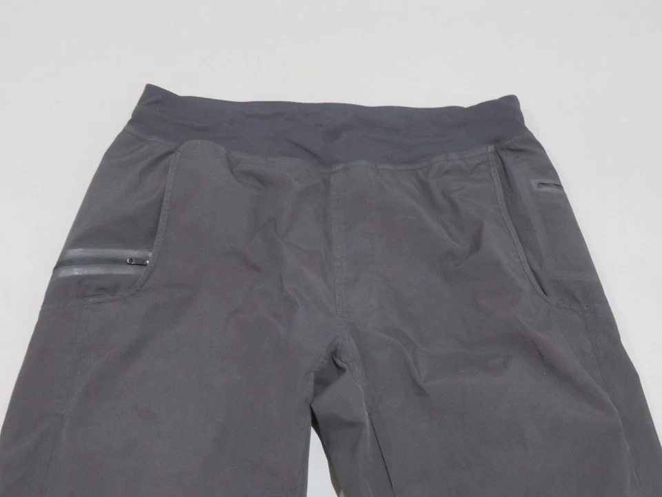Pantalones deportivos Lululemon para hombre grandes negros con bolsillos con cremallera cortavientos para correr informales Foto 2 de 4