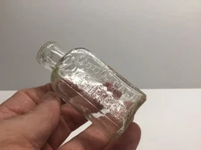 Small Antique Clear Glass Fancy Script Boots Cash Chemist Bottle.