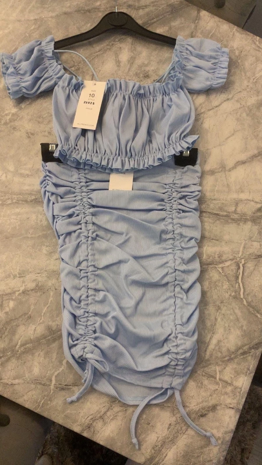 Woman’s skirt and crop top set
Opens in a new window or tab