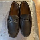 Dark brown textured Allen Edmonds men’s loafers with silver horseshoe-shaped brake handle and visible Made in USA branding.