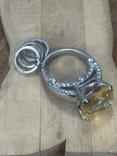 Keychain By  Juicy Couture featuring a yellow...