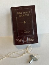VTG How To Get Wealthy Mechanical Wind Up Book Coin Bank Japan Scary Hand Trick