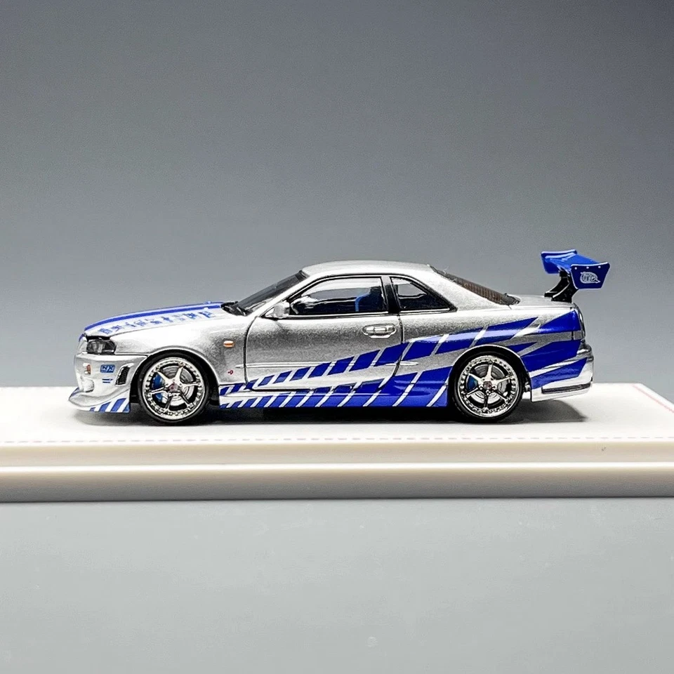 Juguete de regalo modelo de coche fundido a presión plateado/azul Nissan GT-R R34 FNF escala 1/64 FH Foto 4 de 4