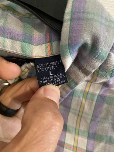 Men’s long-sleeve button-up shirt with purple, green, and yellow plaid pattern, 65% polyester 35% cotton label visible.