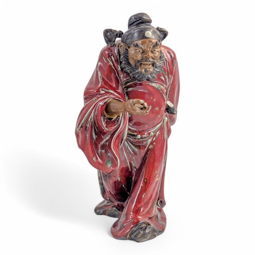 Large Shiwan ware figure of warrior in oxblood glaze, Chinese pottery, c 1950s