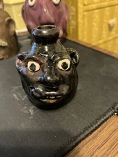 Vintage Marie Rogers Face Jug -3 inches with a dark  brown glaze blue eyes