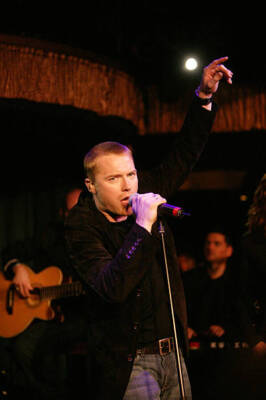Ronan Keating gestures as he on stage at the launch party to cele- 2004 Photo 2