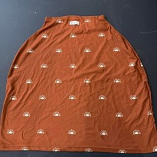 Itzy Ritzy Mom Boss 4-in-1 multi-use cover in the Terracotta Sun design.