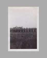 WW2 Photo U.S. Soldiers In Rows Standing At Attention Field Buildings In Back