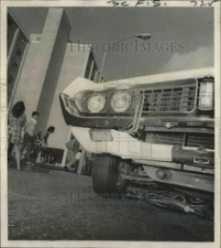 1971 Press Photo Accidents- Bicycle remains crumpled and twisted under car.