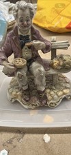 Capodimonte vintage figure of 'Old man on park bench eating '