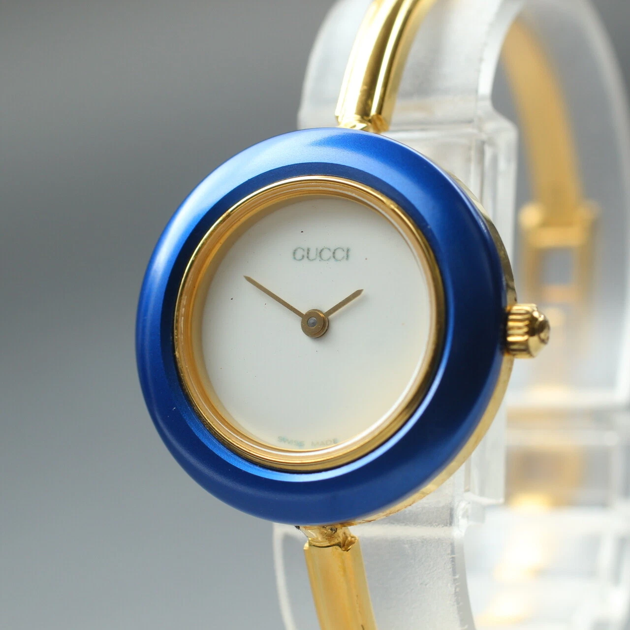 [Presque comme neuve] Montre femme Gucci lunette changeante 11/12,2 lunette dorée bleue quartz
