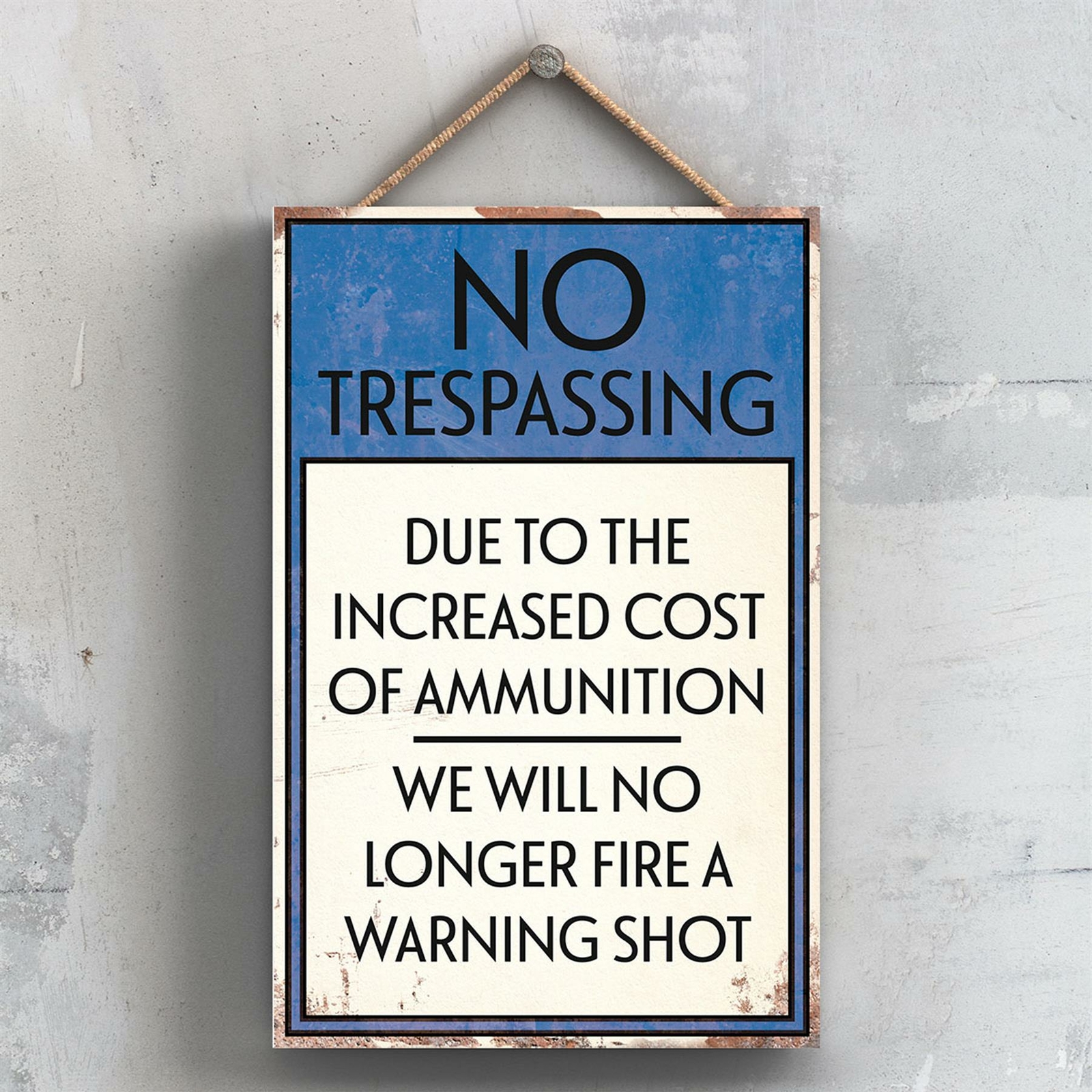 NO TRESPASSING NO WARNING SHOTS TYPOGRAPHY SIGN PRINTED ONTO A WOODEN PLAQUE