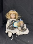 8 small dolls porcelain & plastic from different makers.  — photo 4