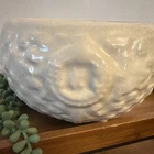 Vintage McCoy planter features an embossed basket weave pattern