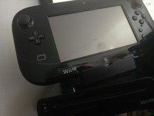 WII U console with game pad with 7 games included. Tested and working