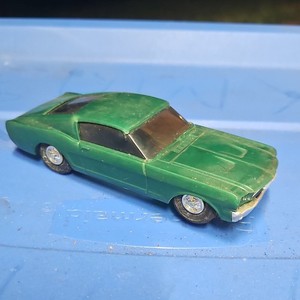  partial Eldon slot car and the body is a Ford Mustang Fastback.