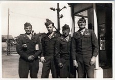 WW2 Photo of Four US Soldiers Standing Together on Street