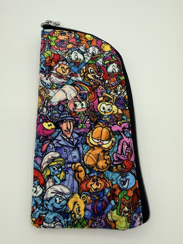 A zipper pouch eyeglass case featuring Garfield, the Smurfs, Inspector Gadget, and Snorks — pure 80s cartoon gold in one gloriously random accessory.