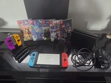 Nintendo Switch Bundle- console, various games, controllers, charging dock.