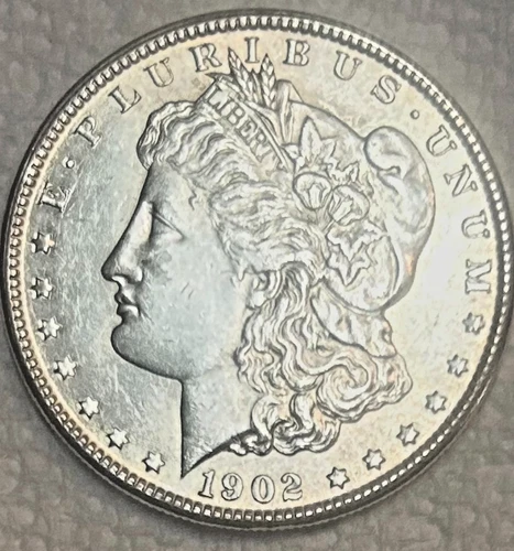 1902 O Morgan just barely circulated. gorgeous AU or better. no ship Sigma test+