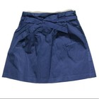 Navy blue paperbag waist skirt with matching fabric belt, side buckle detail, and “USA Made!” text on inner waistband.