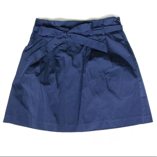 Navy blue paperbag waist skirt with matching fabric belt, side buckle detail, and “USA Made!” text on inner waistband.
