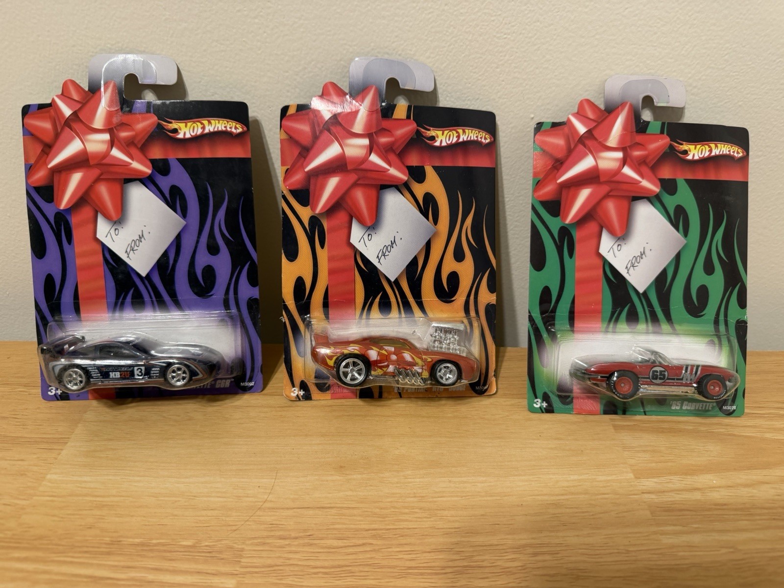 Hot Wheels 2007 Holiday Hot Rods Corvette C6R , 65 Corvette, 69 Pontiac GTO, (3)