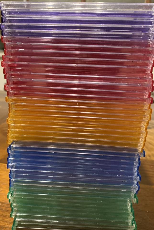 Lot of 43 colorful CD/DVD cases 5 purple 10 Red 9 yellow 9 blue 10 ...