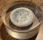 1890-O MORGAN DOLLAR ENCASED IN 1" THICK ACRYLIC PAPERWEIGHT
