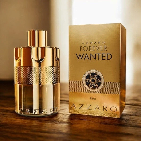 Gold-labeled bottle of Azzaro Forever Wanted Elixir 3.3/3.4 oz with textured cap and “AZZARO FOREVER WANTED” text.