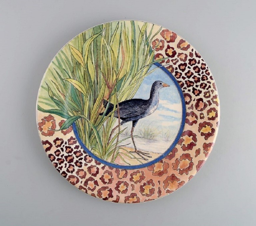Gien, France. Two Savane porcelain plates with hand-painted exotic
