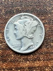 1942 s mercury dime bu a extra fine coin . pluse a surprise