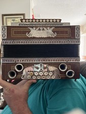 Jos. Filatsch Vintage Accordion with Ornate Metalwork and Decorative Buttons