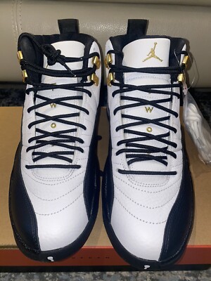 white and navy jordan 12