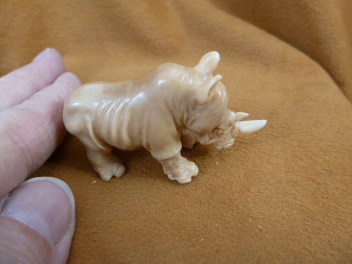 tb-rhino-4) little tan rhino Rhinoceros Tagua NUT palm figurine